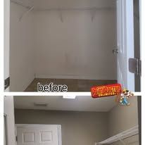 Empty closet before renovation, featuring shelves, door, and a 