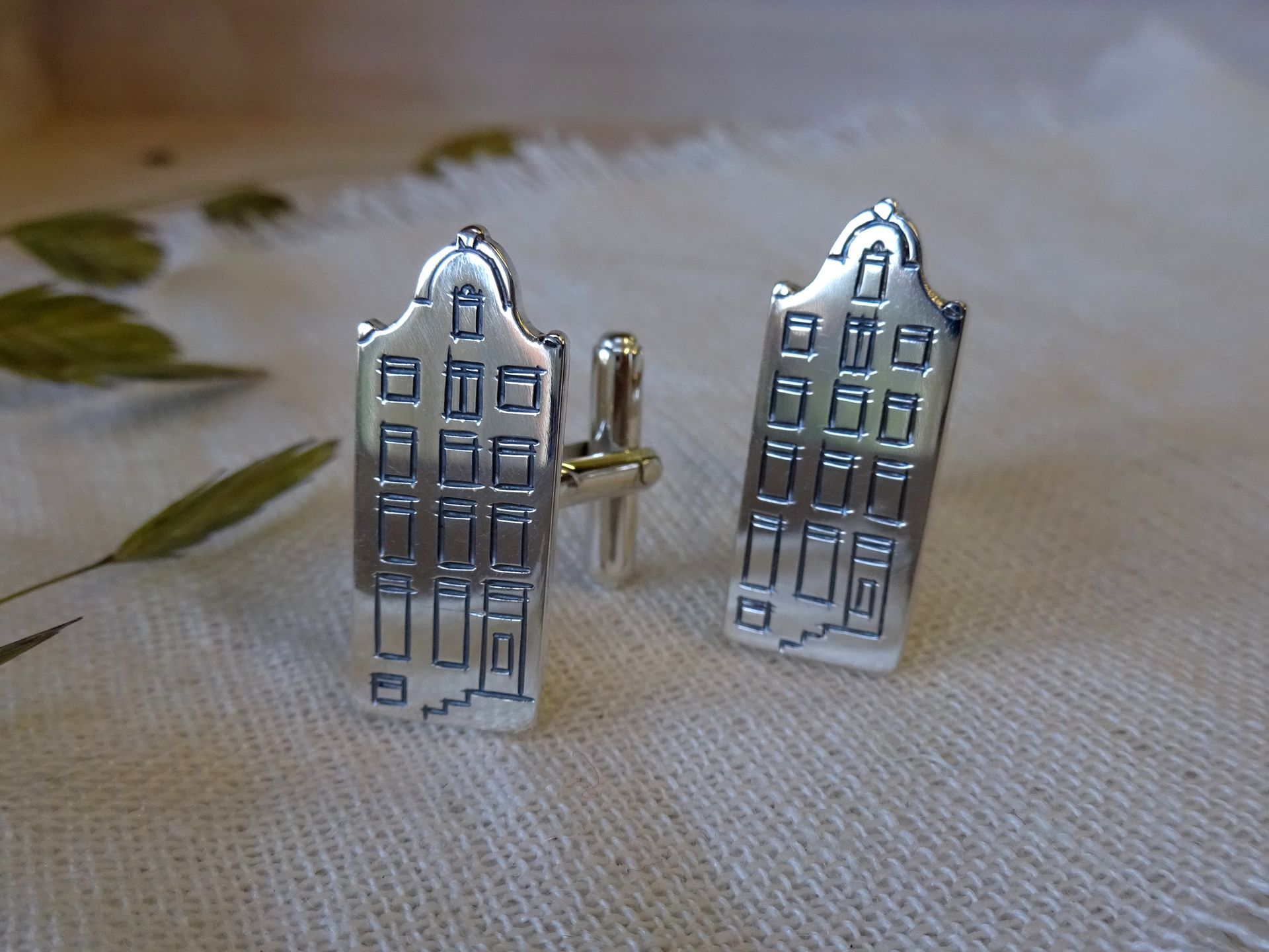 Manchetknopen van zilver van het pulitzer hotel in Amsterdam.