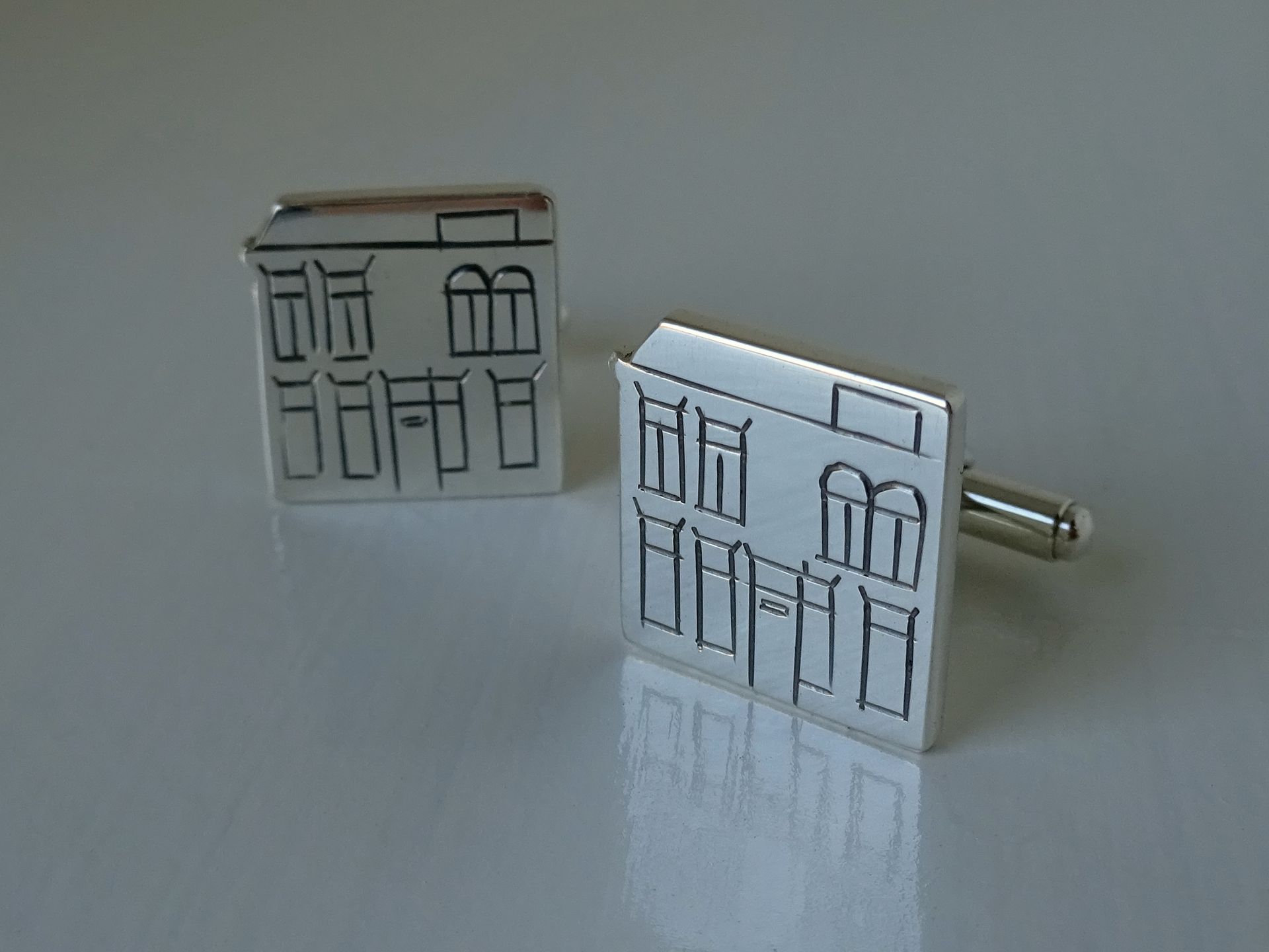 Manchetknopen van zilver van de klants eigen huis.