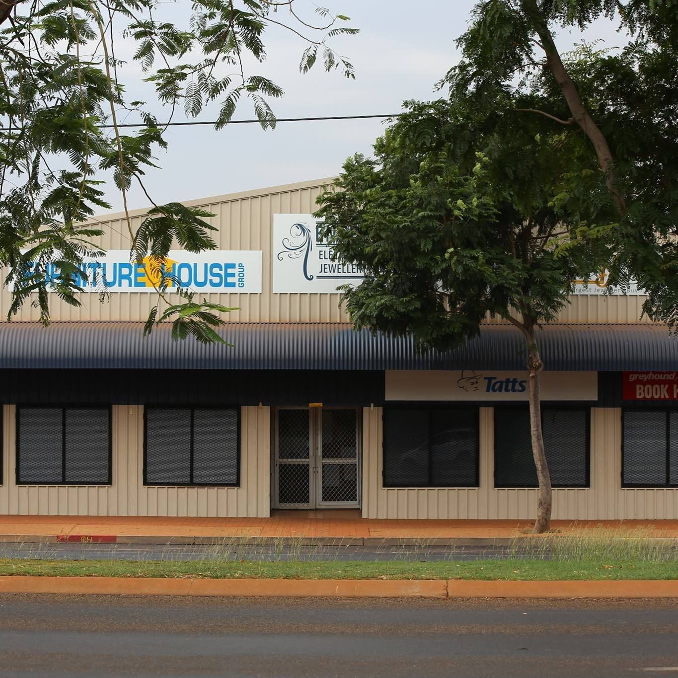 A Two-story Commercial Building With Signage — Enterprise Electrics NT Pty Ltd in Tennant Creek, NT