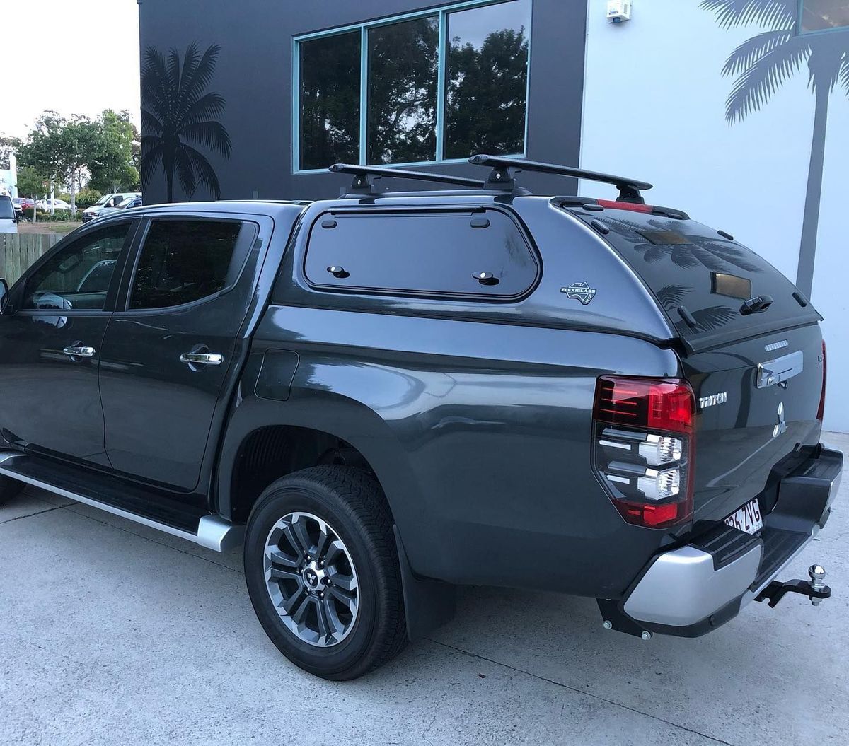 Dark Gray Pickup Truck With a Canopy Parked Outside a Building — All Coast Auto Solutions in Noosaville, QLD