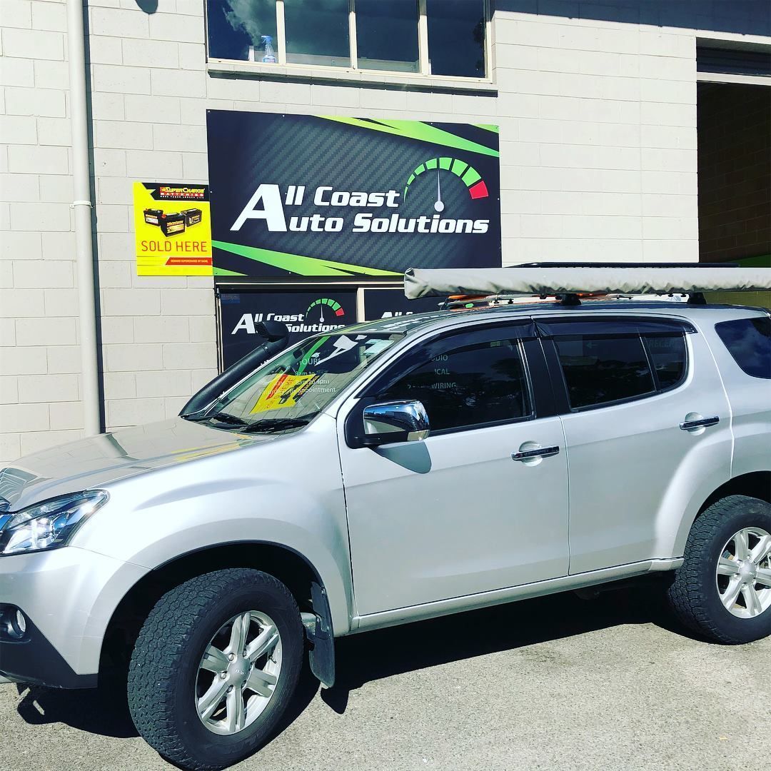 Silver SUV Parked in Front of an Auto Repair Shop With a Sign — All Coast Auto Solutions in Noosaville, QLD