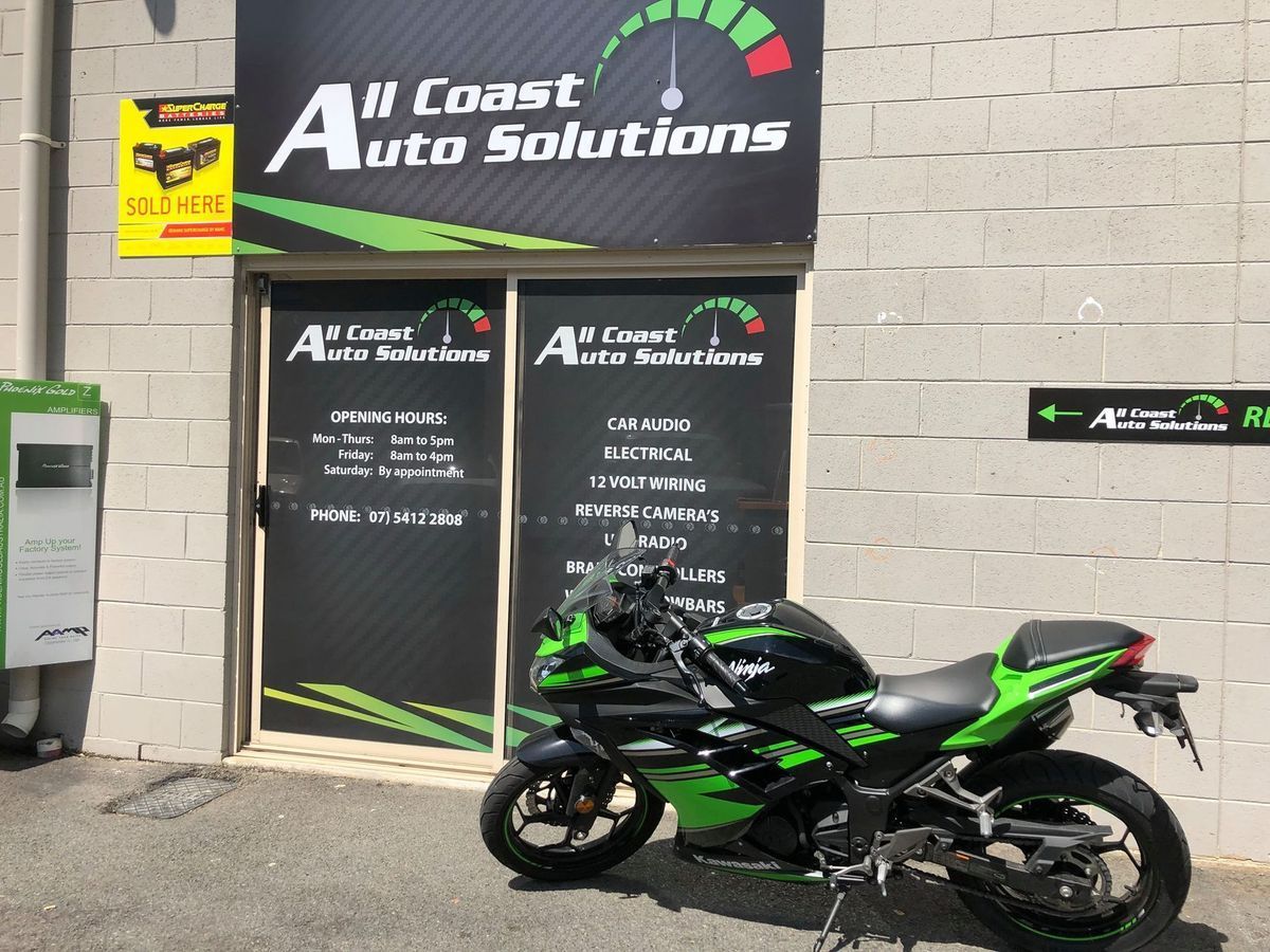 A Green and Black Motorcycle Parked in Front of All Coast Auto Solutions Shop — All Coast Auto Solutions in Noosaville, QLD