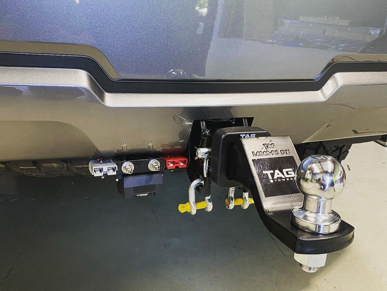 Black Trailer Hitch Mounted on a Vehicle's Rear With a Tow Ball— All Coast Auto Solutions in Noosaville, QLD