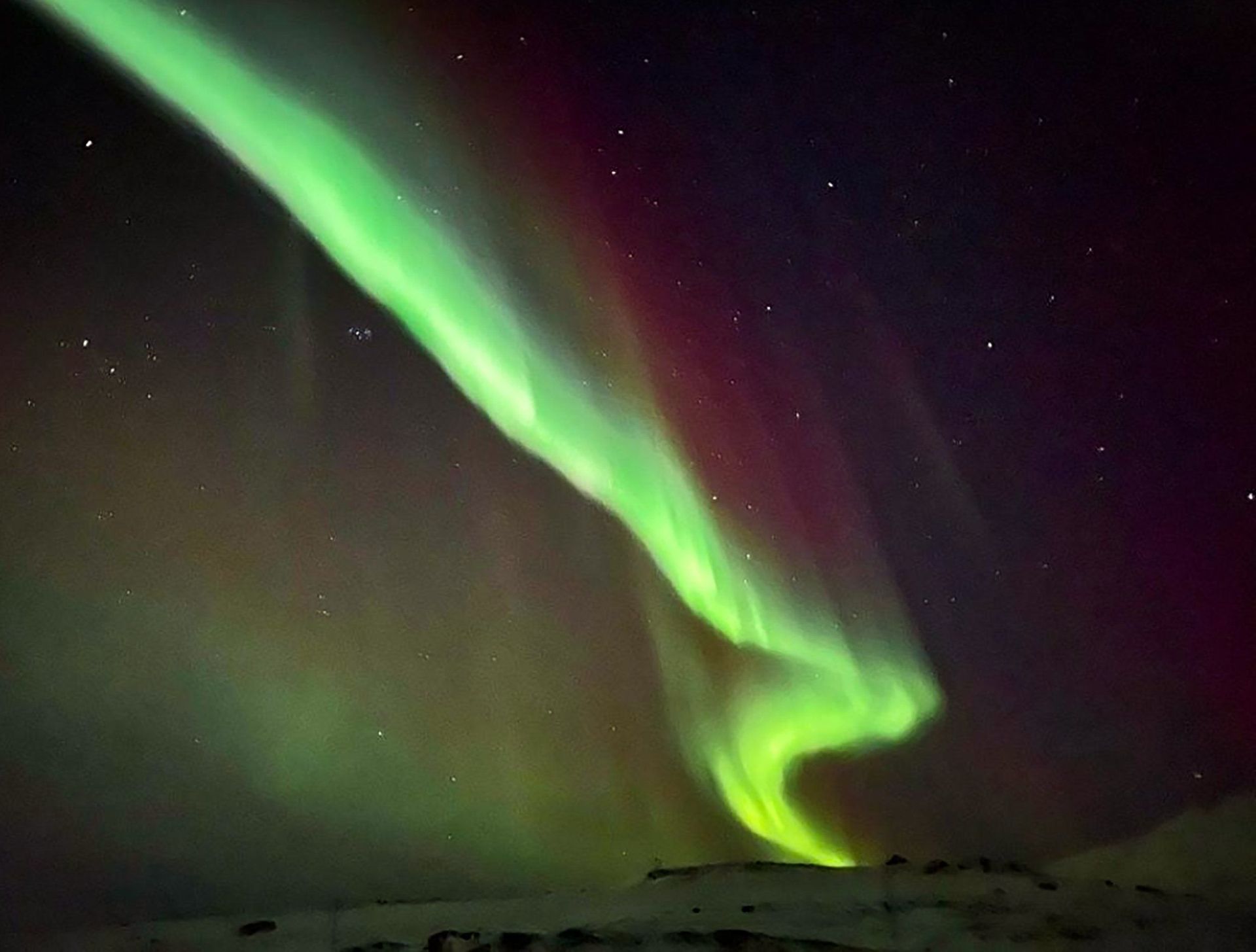 The northern lights are dancing in the night sky