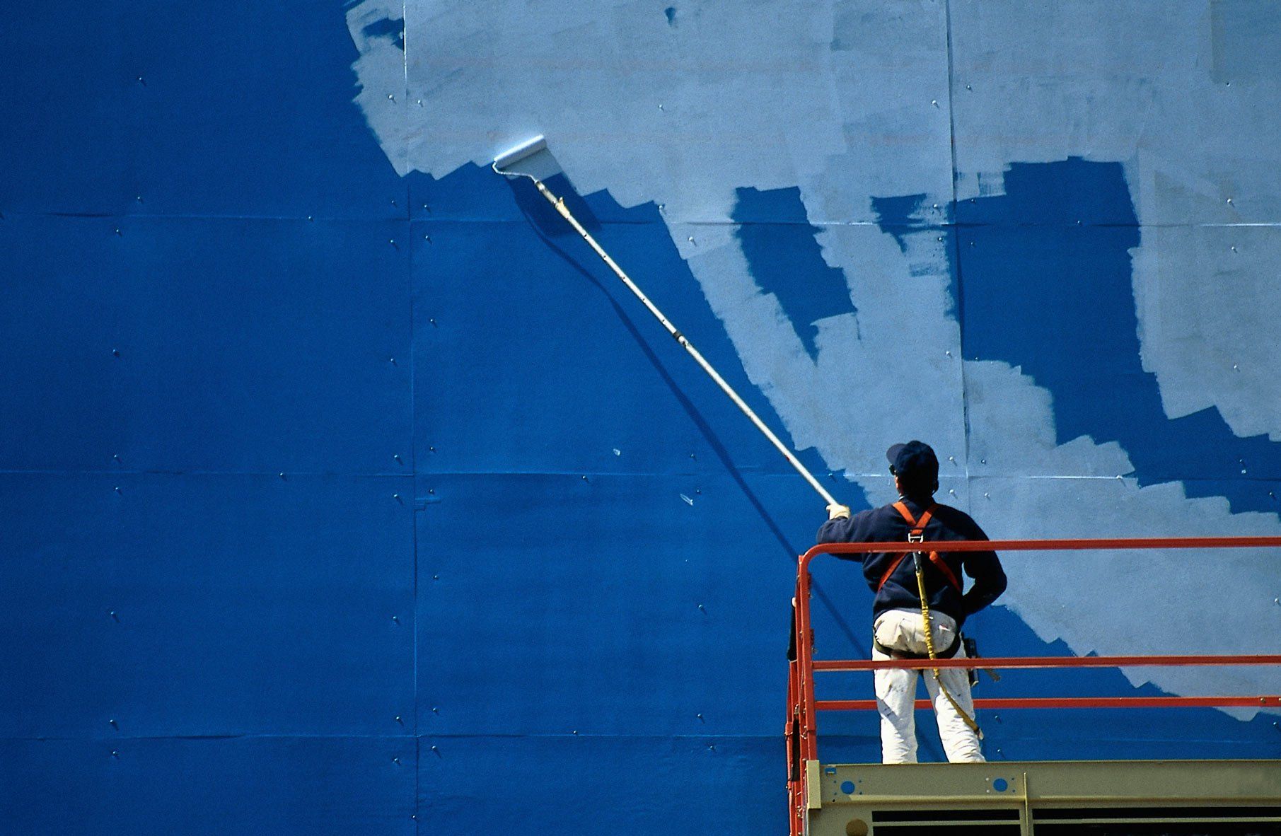 Worker Painting Commercial Wall — Bolingbrook, IL — A & D Quality Painting