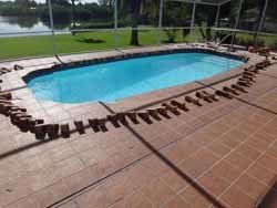 Pavement Around Swimming Pool — Sarasota, FL — Custom Pavers of Southwest Florida