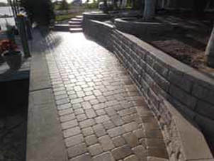 Backyard with Retaining Wall — Sarasota, FL — Custom Pavers of Southwest Florida