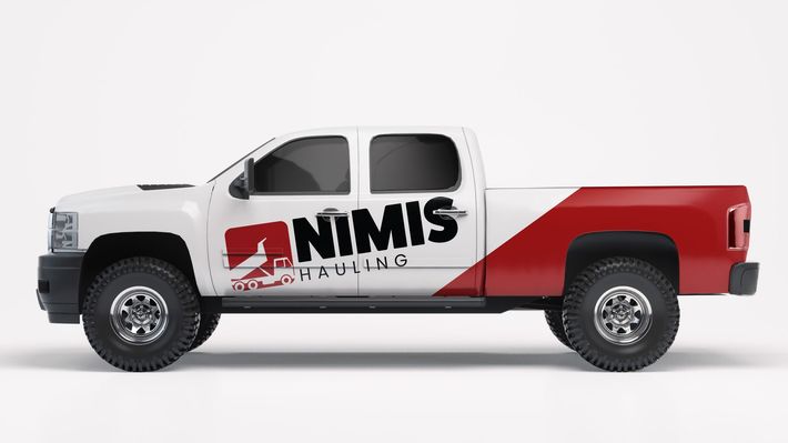 A white and red truck with the word nimis on the side