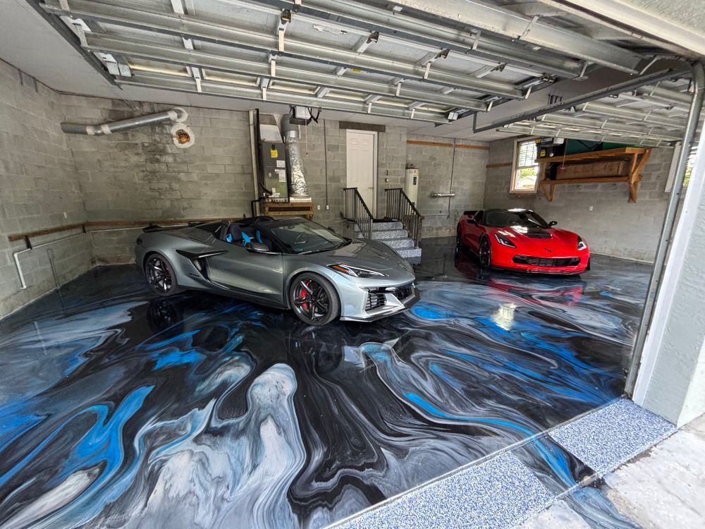 Two cars are parked in a garage with a marble floor.