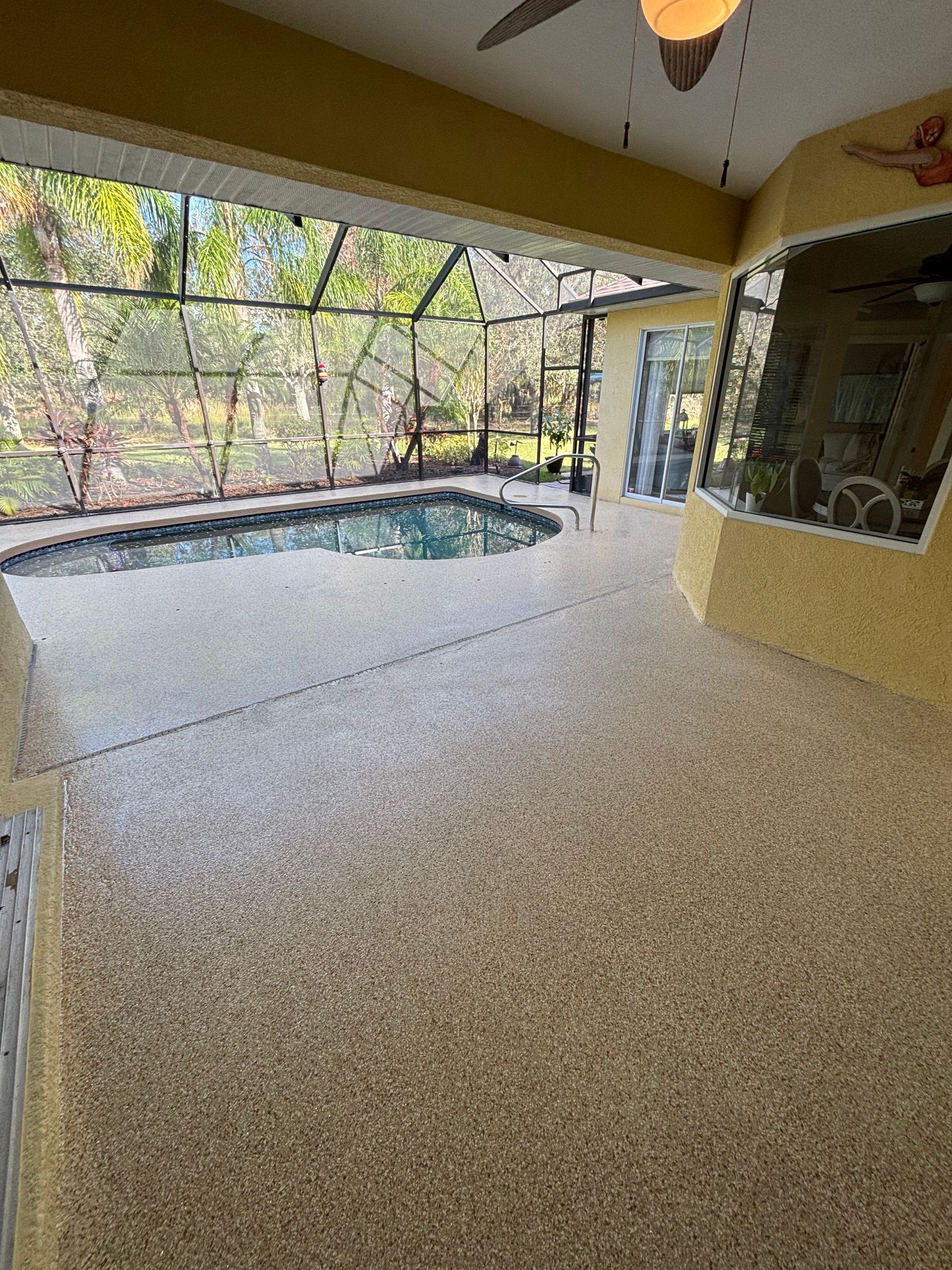 There is a swimming pool in the backyard of a house.
