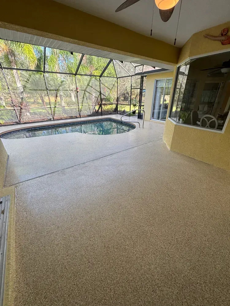 There is a swimming pool in the backyard of a house.