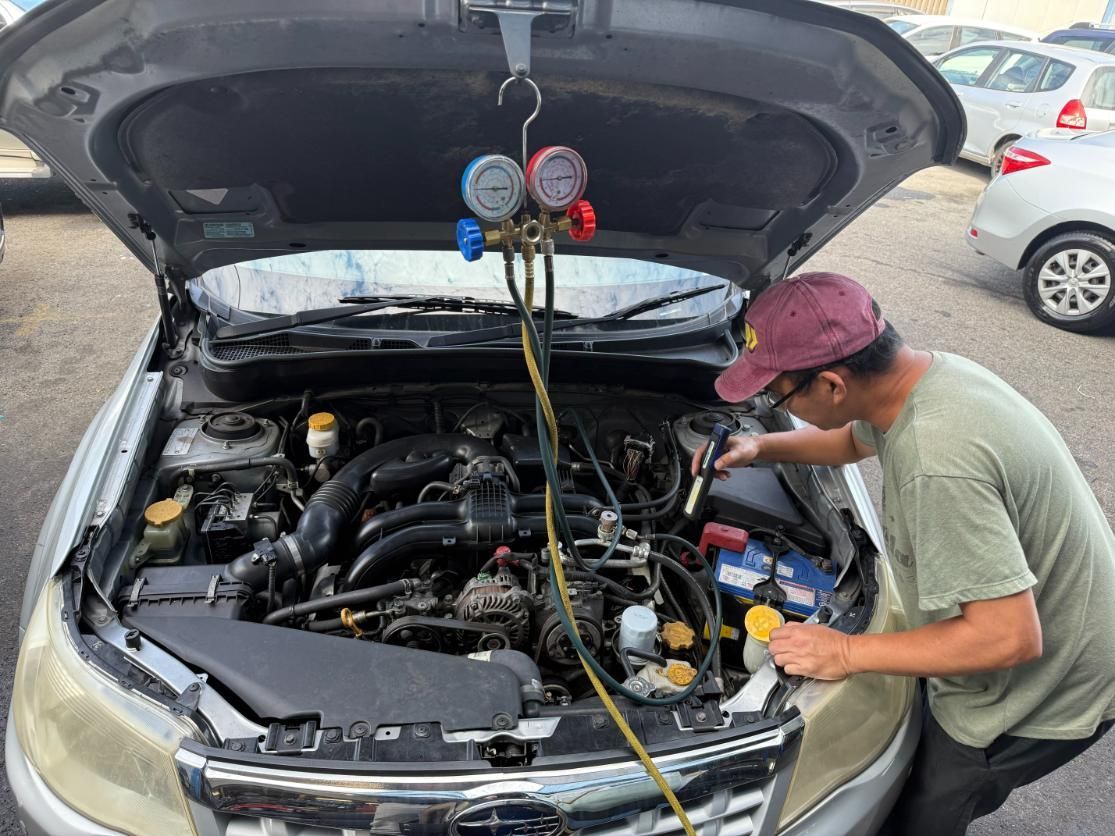 A Man is Working Under the Hood of a Car — ABIV Automotive In Richlands, QLD