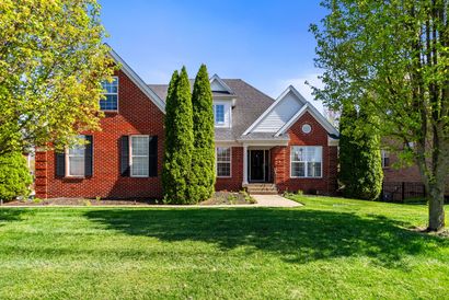 A kitchen with a large island in the middle of it.