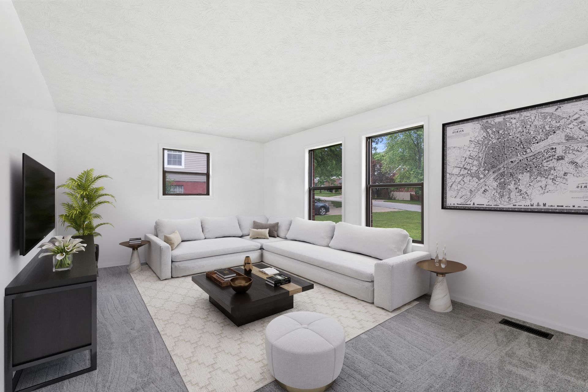 A living room filled with furniture and a fireplace.