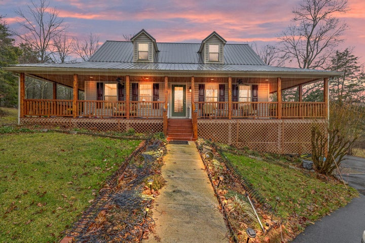 A living room with a blue couch and a yellow chair