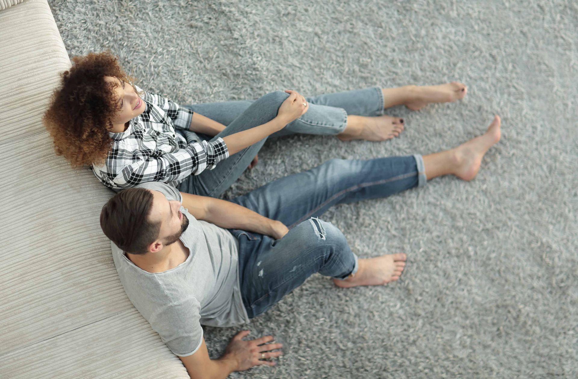 Standing on a carpet with bare feet