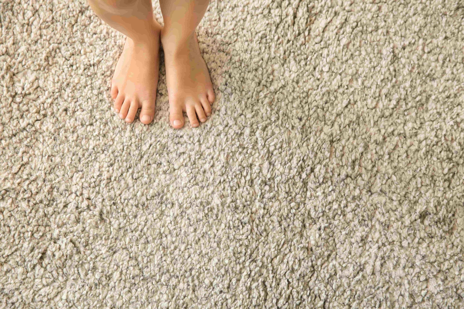 Standing on a carpet with bare feet