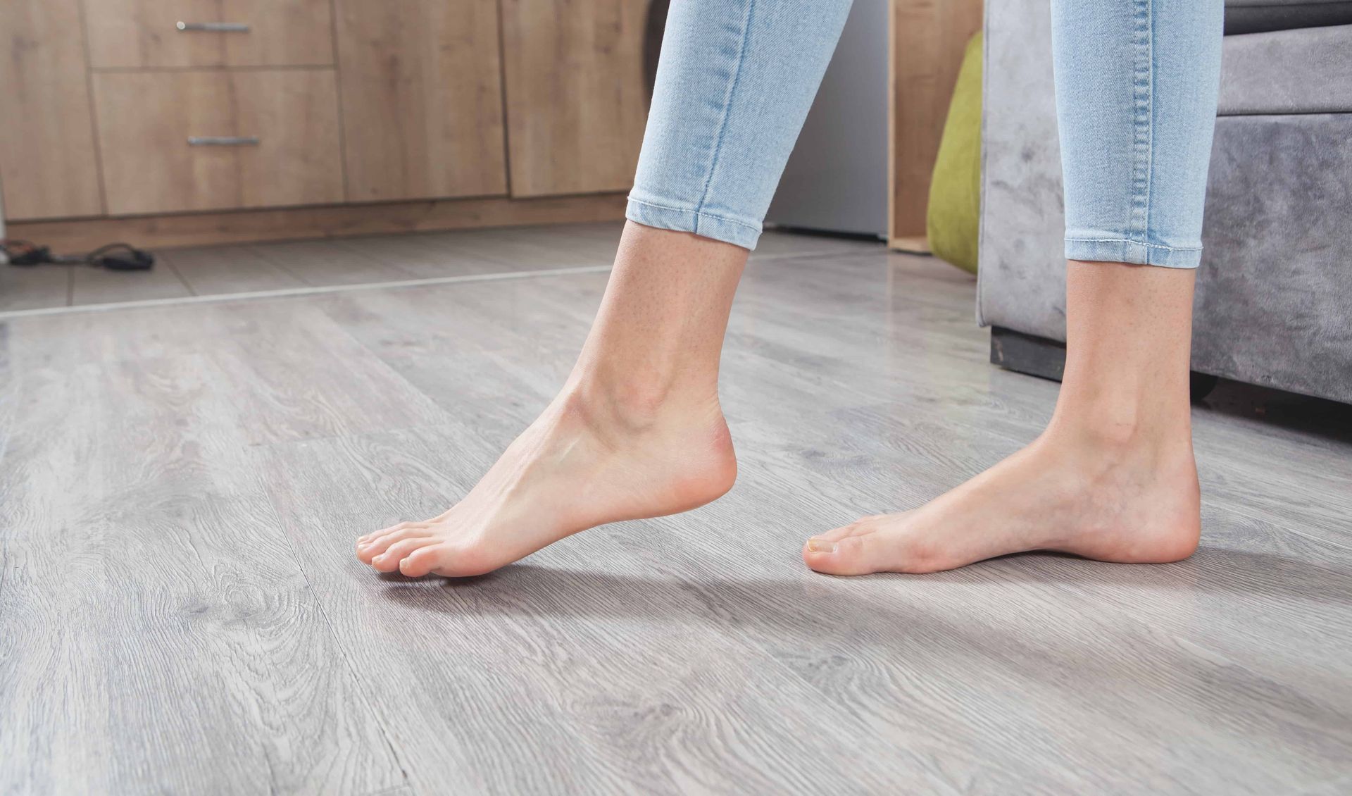 Woman walking on new flooring with bare feet