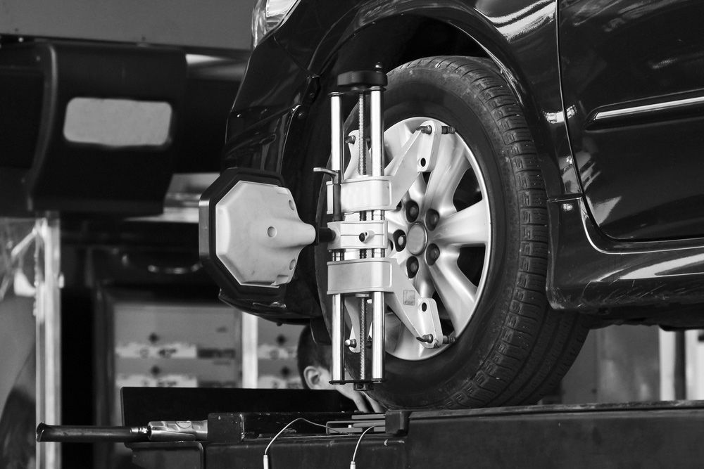 A Car Is Being Adjusted By A Machine In A Garage — Advanced Auto Tech In Port Macquarie, NSW