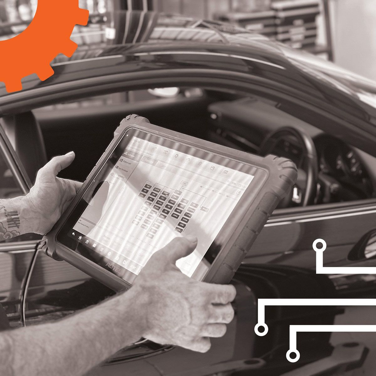 A Black And White Photo Of A Person Holding A Tablet In Front Of A Car — Advanced Auto Tech In Port Macquarie, NSW