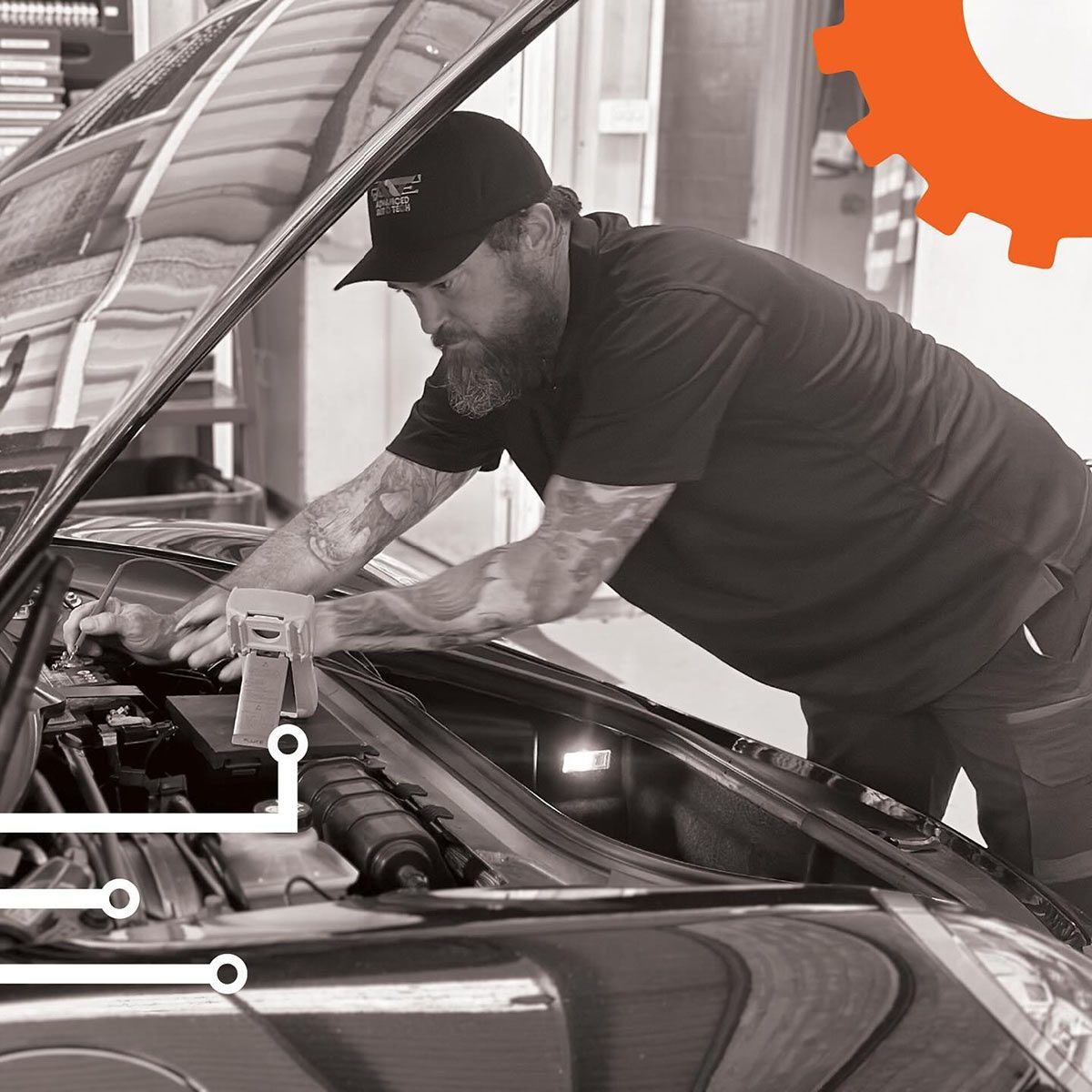 A Man Is Working On A Car With The Hood Open — Advanced Auto Tech In Port Macquarie, NSW