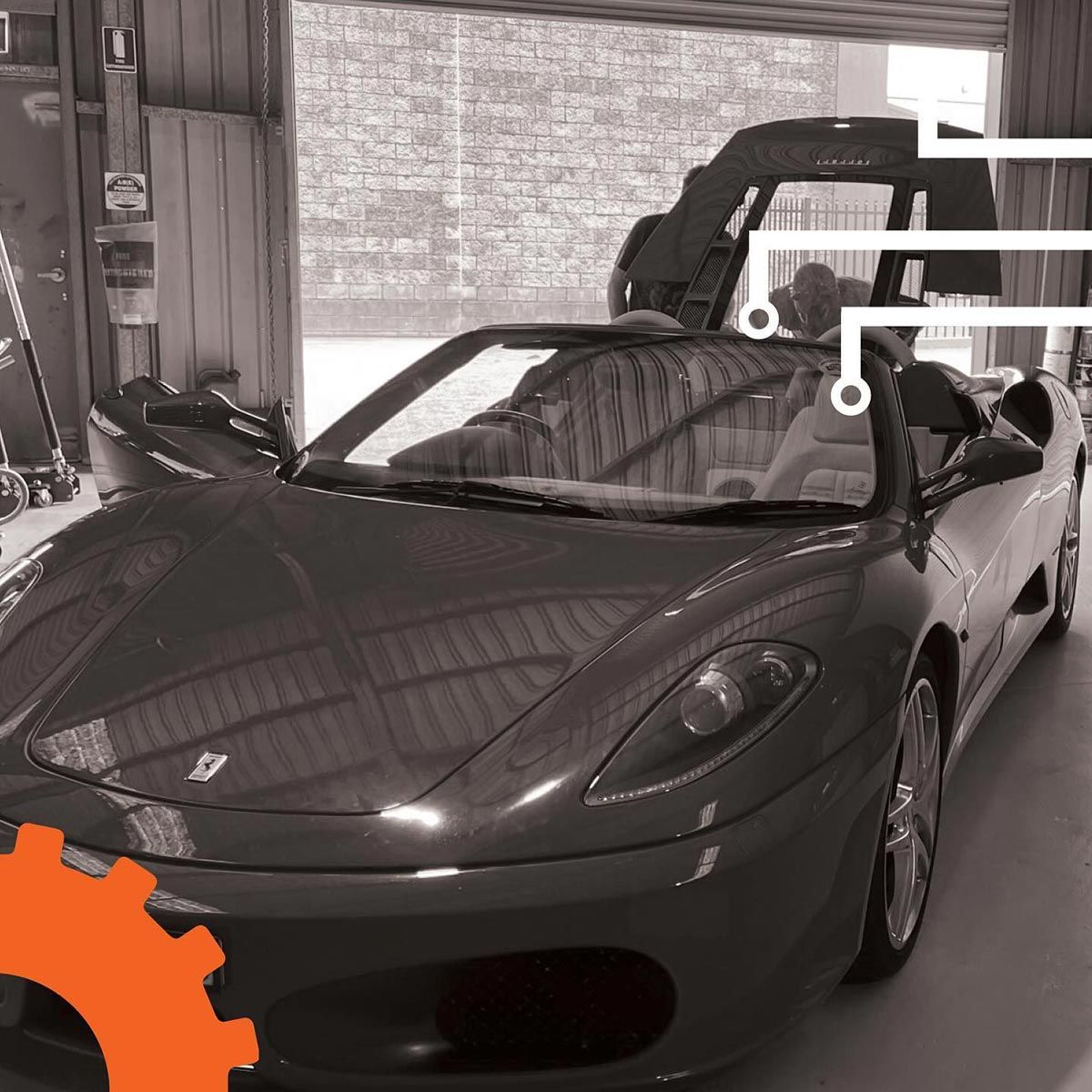 A Black Sports Car Is Parked In A Garage — Advanced Auto Tech In Port Macquarie, NSW