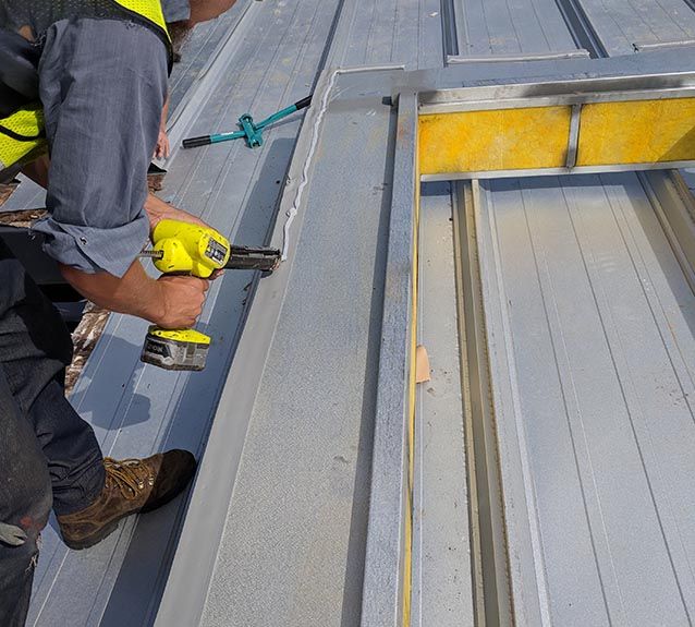 Man Working on a Steel Building Renovation