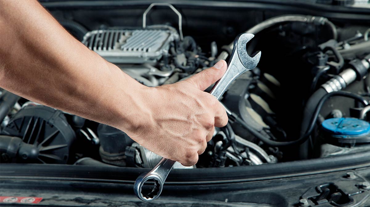 Auto Mechanic Holding A Wrench — Expert Mechanic In Cairns, QLD
