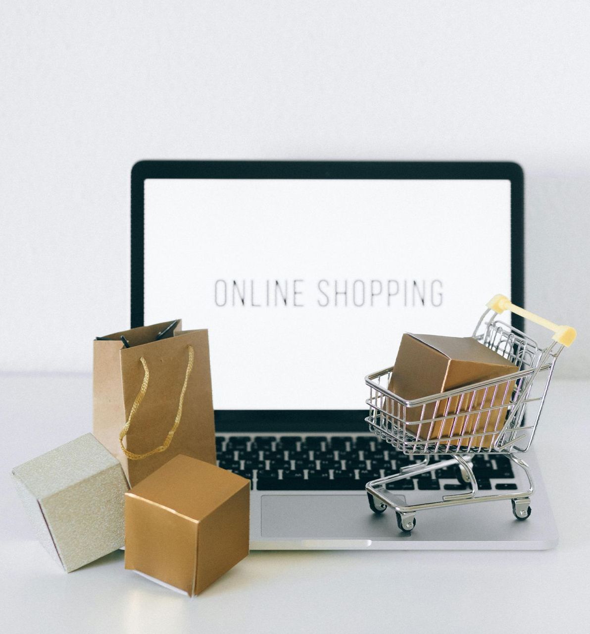 A laptop with the word online shopping on the screen