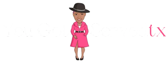 Woman in a pink coat and black hat.