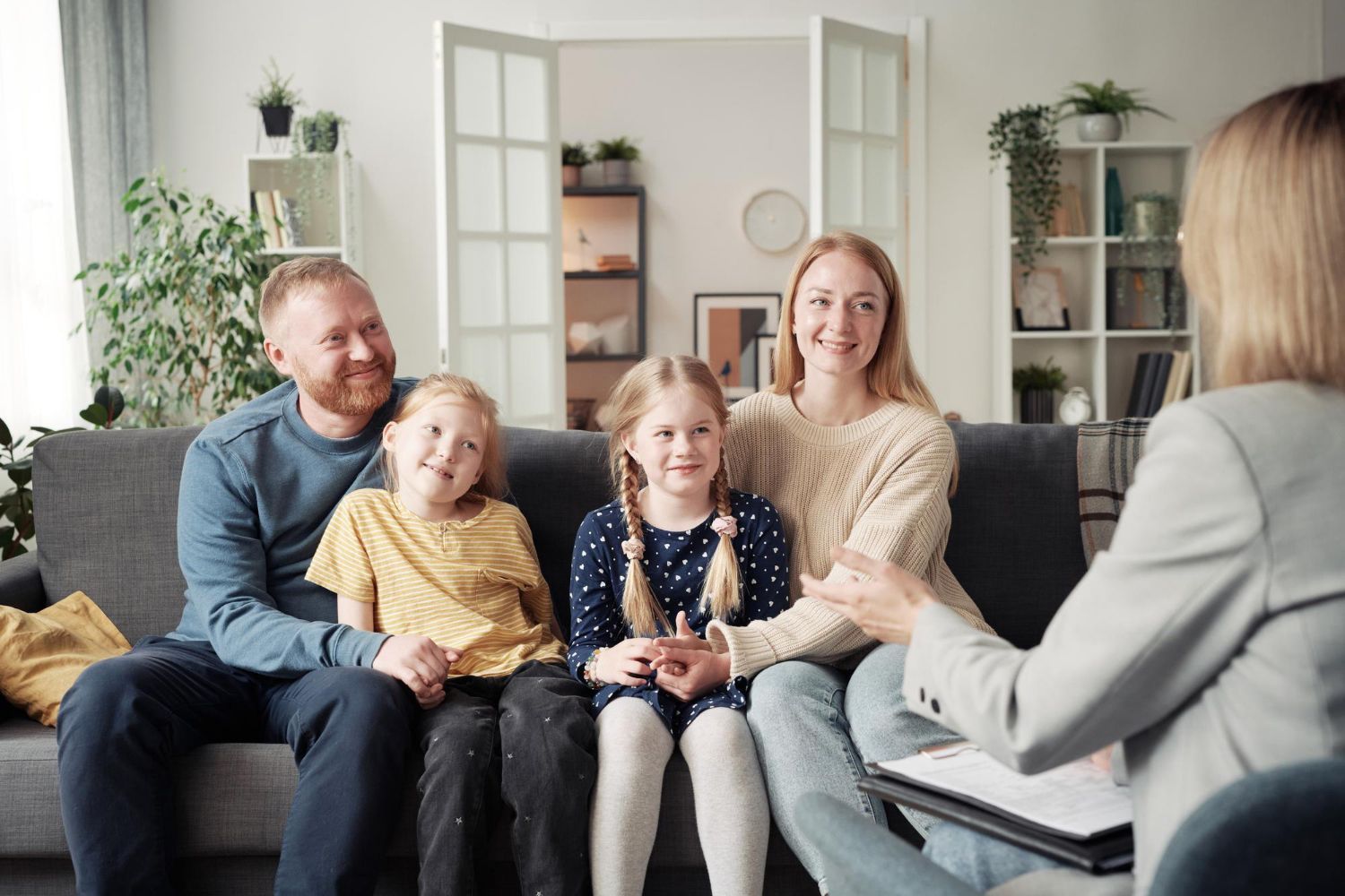 Happy family bonding together at home after autism therapy support