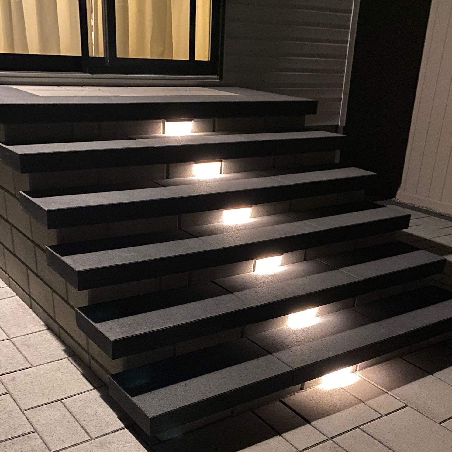 a set of stairs that are lit up at night
