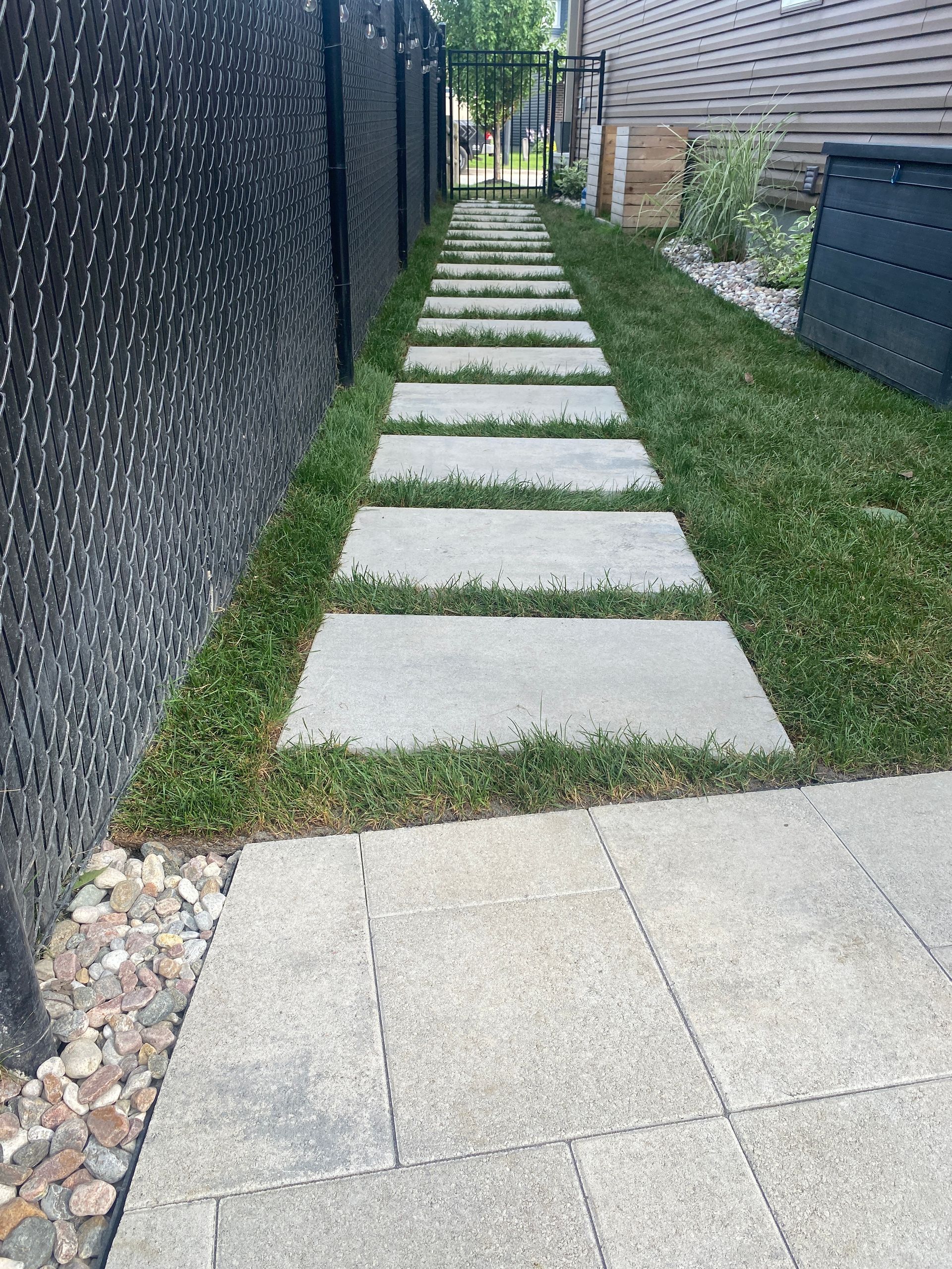 walkway with grass around it