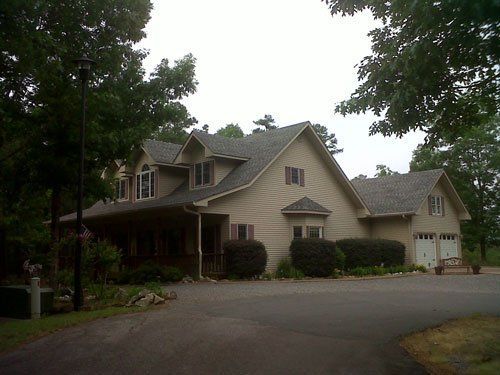 A large house with a driveway in front of it