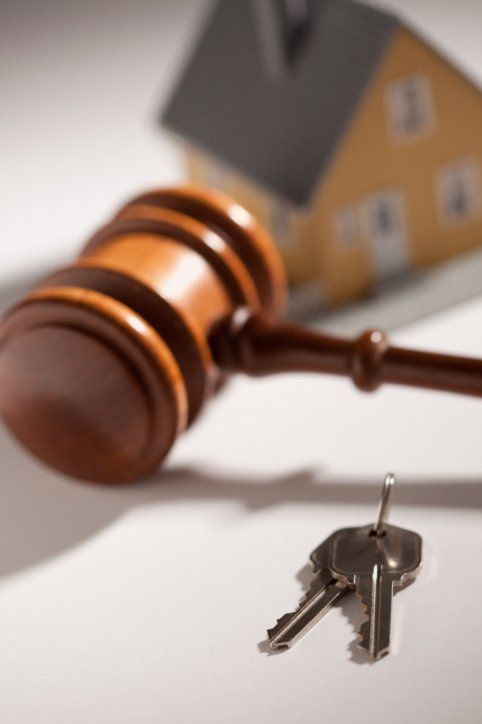 Court gavel, key and miniature house — Real Estate Law in Springfield, MA