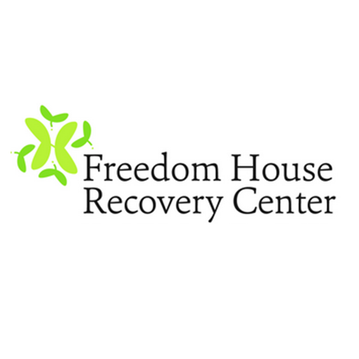 The logo for the freedom house recovery center is green and black.