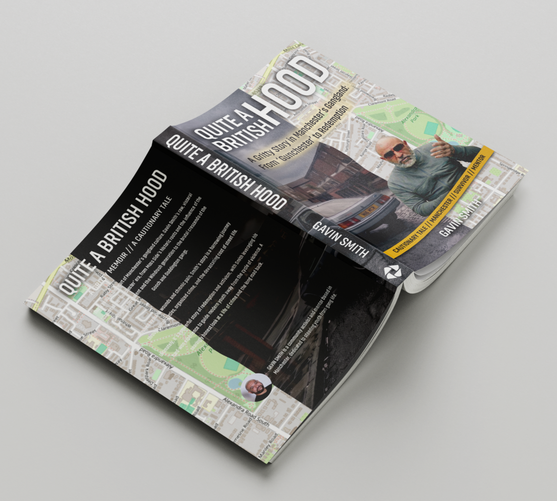 Open book with black and gray pages and a photo on the cover