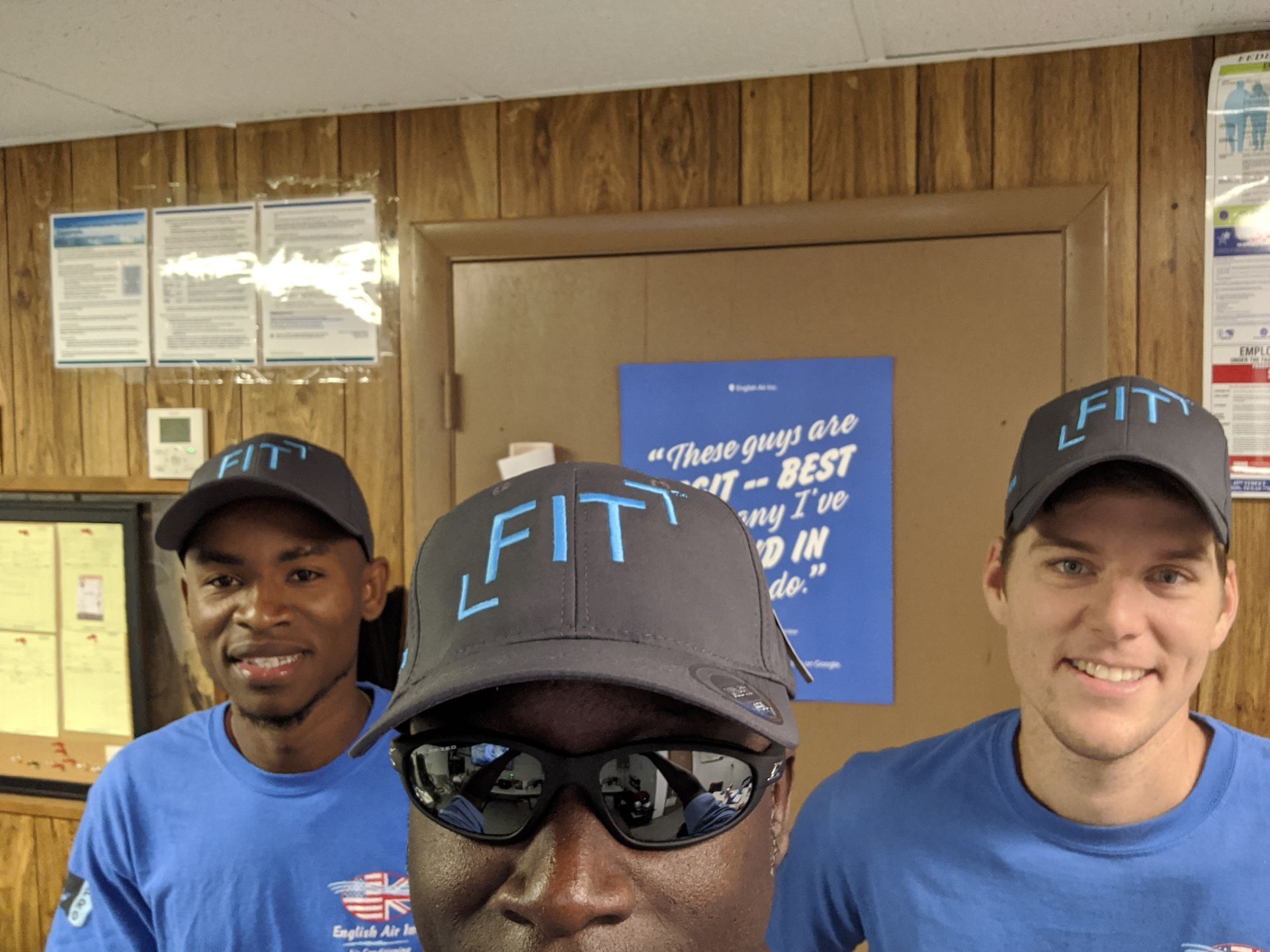 A man wearing a hat with the word fit on it