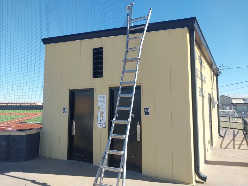 A ladder is attached to the side of a building