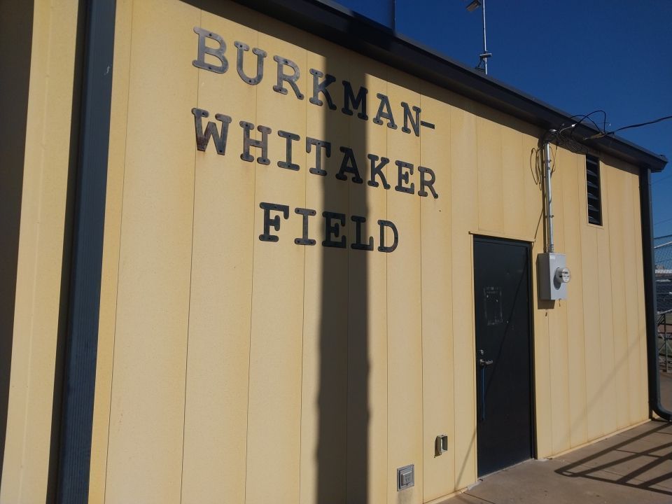 A building with the name burkman whittaker field on it