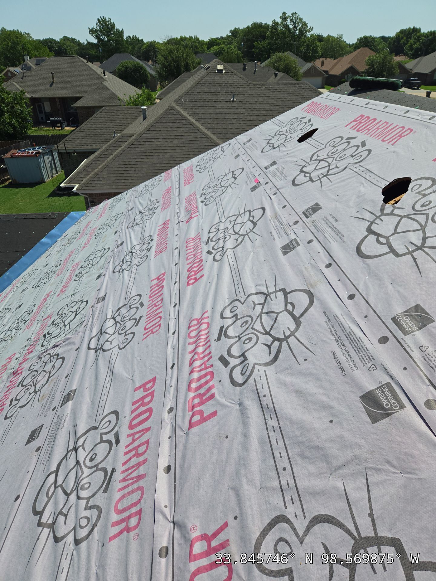 A roof with a lot of roofing material on it