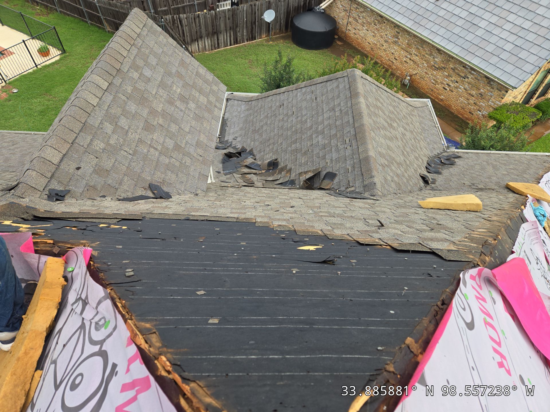 An aerial view of a roof that is being repaired.