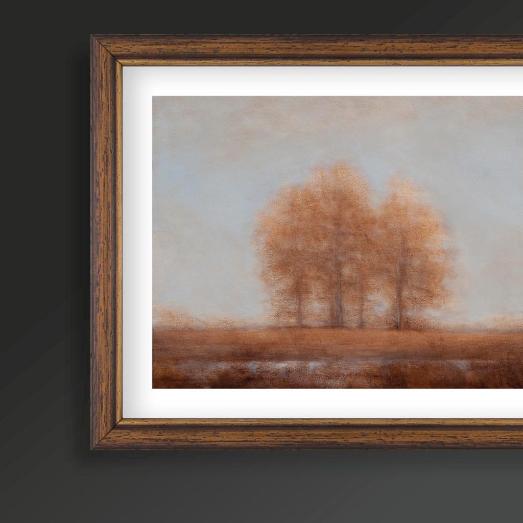 Un dipinto incorniciato di alberi in un campo