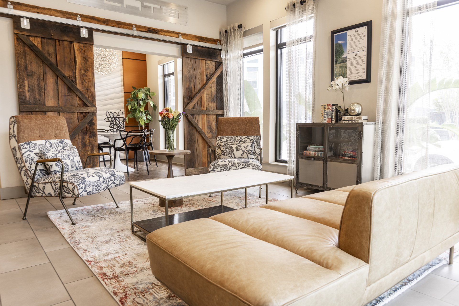 common area with couches and wooden door at NoHo Flats