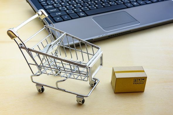 Ecommerce - shopping trolley and laptop