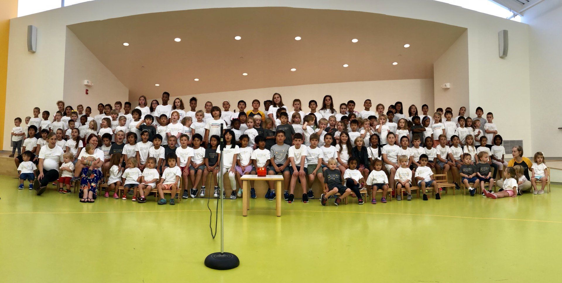 Diverse Montessori student population during an assembly