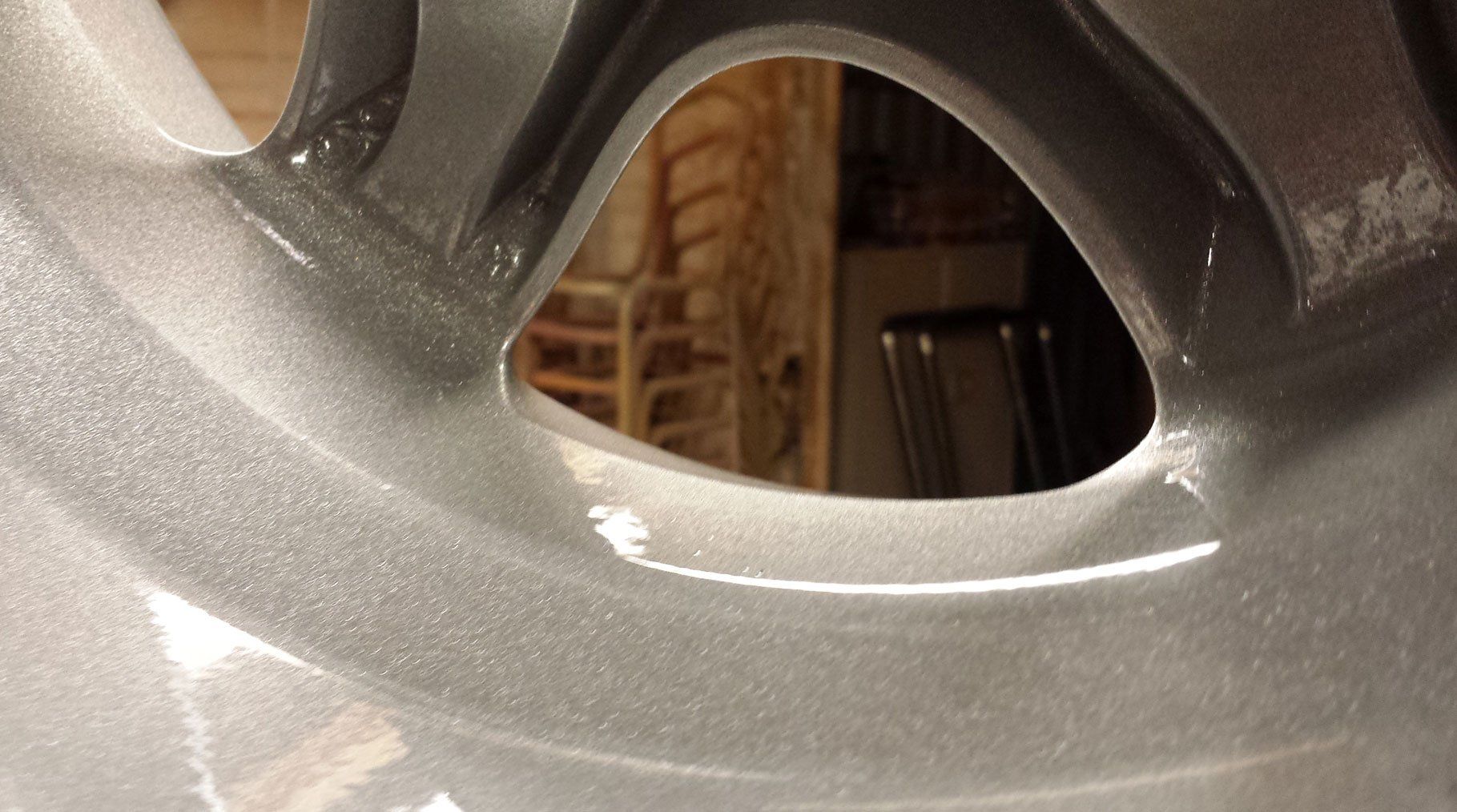 Wheel powder-coated in silver and then a lacquer applied