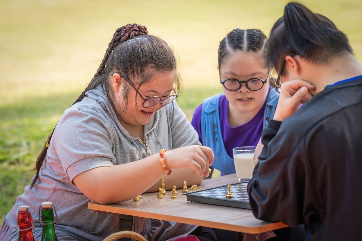 teens with special needs playing chess