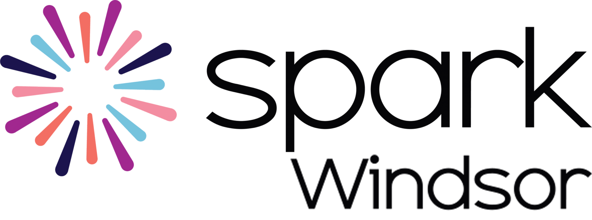 Logo with a colorful burst design next to the text "spark living".